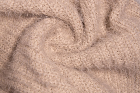 Knitwear texture. Soft texture of homemade cashmere wool sweater.の写真素材
