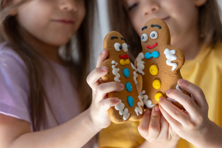 Christmas Gingerbread man cookies in kids hands.の写真素材
