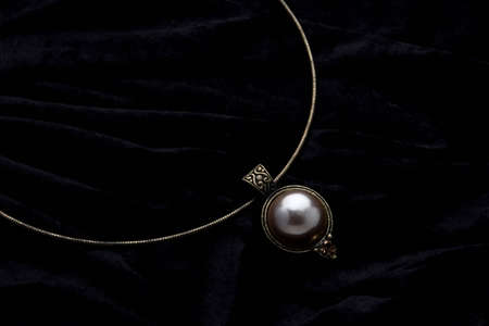 Silver designer costume juwelery on black velvet backgroundの写真素材