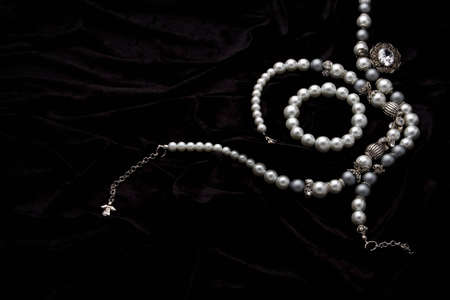 Silver designer costume juwelery on black velvet backgroundの写真素材