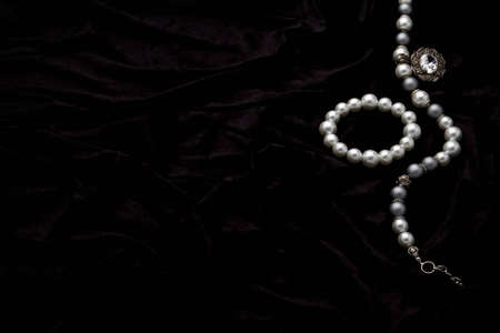 Silver designer costume juwelery on black velvet backgroundの写真素材
