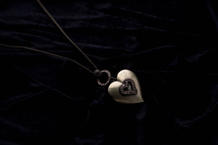 Silver designer costume jewelery on black velvet background