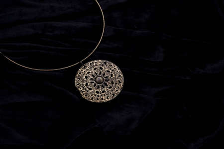 Silver designer costume jewelery on black velvet backgroundの写真素材