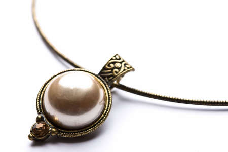 Bras designer costume jewelery in macro on white backgroundの写真素材