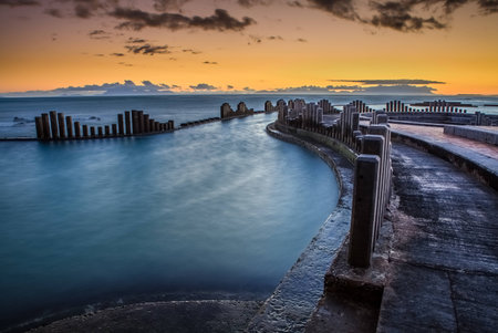 Low tide at the Strand tidal pool overlooking false bayの写真素材