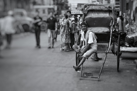 A hand rickshaw puller enjoying his break after a day of hard workのeditorial素材