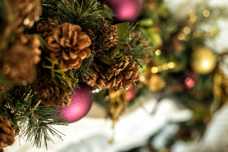 Christmas decorations on the fireplace, cones and ballsの写真素材