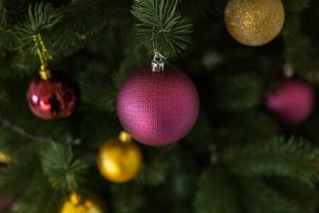 Decorations, purple and gold  balls on Christmas treeの写真素材