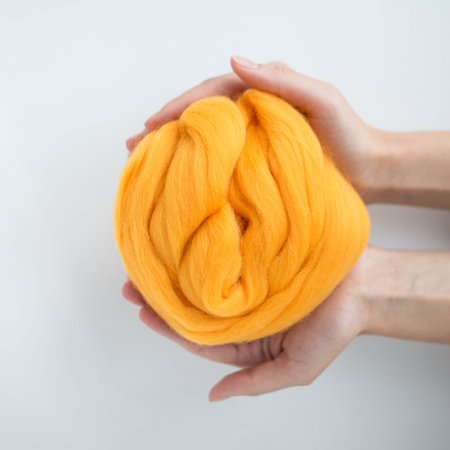 Close-up of  merino wool ball in hands.