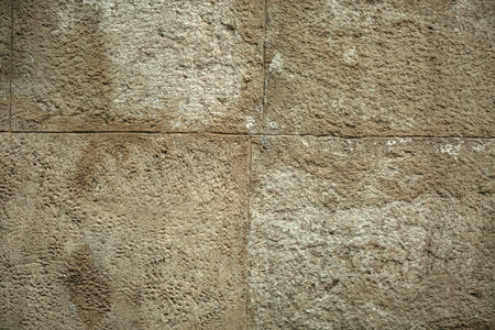 Cracked old stone wall background, stone grunge texture close up.の写真素材