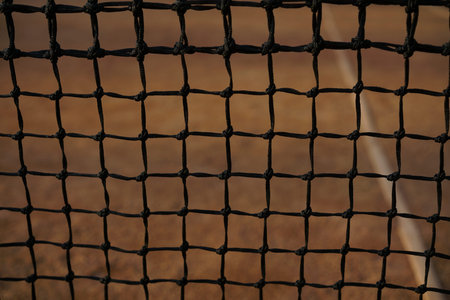 Tennis court black net closeup on the background of coverage