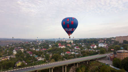Ukraine October 3, 2020, Kamyanets Podolsk Balloon Festival, morning launch. Cloudiness Flying over the bridge to the old townのeditorial素材