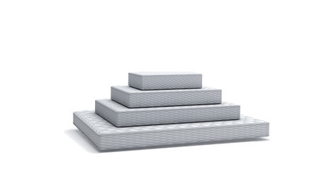 Mattresses lying on top of each other in the form of a pyramid on a white background. 3d renderingの写真素材