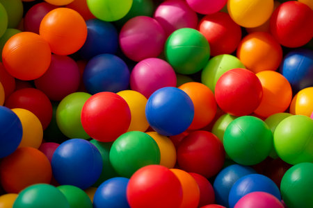 background of a heap of colored plastic balls in the playgroundの写真素材
