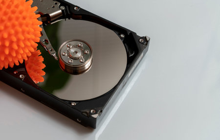 Concept, data infected by a virus. Disassembled hard drive with virus