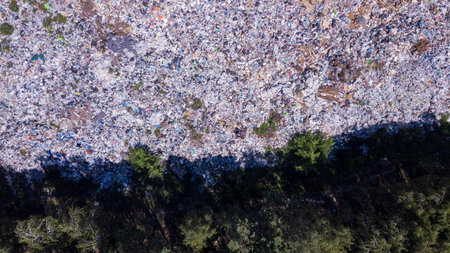 Birds eye view of a garbage dump where machinery equals mountains of household waste, Ukraine....