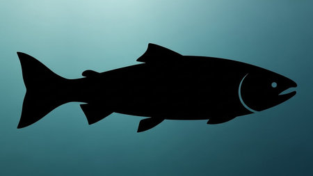 Black silhouette of a salmon against a blue gradient backgroundの素材