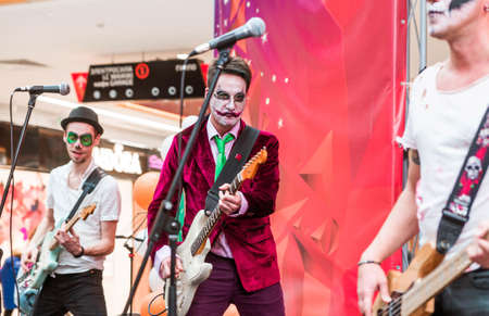 Minsk, Belarus - October 29, 2019. Halloween celebration in the shopping center. Musicians in makeup and costumes perform on stage. Horizontal photoのeditorial素材