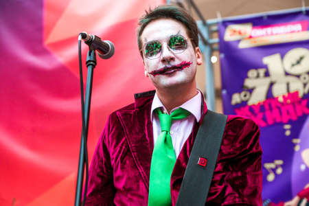 Minsk, Belarus - October 29, 2019. Halloween celebration in the shopping center. Musicians in makeup and costumes perform on stage. The artist looks at the camera. Horizontal photoのeditorial素材