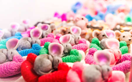 Photo of Sleeping mice. Many small figurines in a shop windowの写真素材