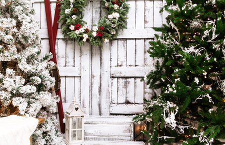 Christmas decorated house and yard. Studio decoration in New Year style. Snow covered courtyard of a wooden house or cottage. Backdrop for photographerの写真素材