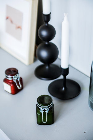 Home interior decor. Glass jar with aroma candle. Living room decoration. Photoの写真素材