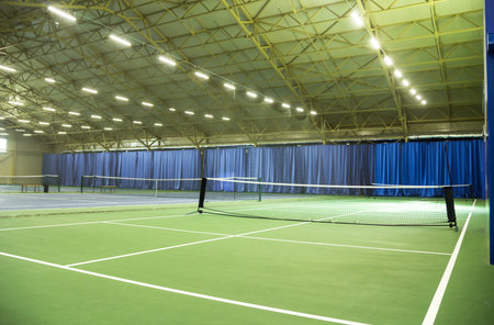 Interior of modern trendy indoor tennis court. Horizontal photo. Minsk, Belarus- May 25, 2022のeditorial素材