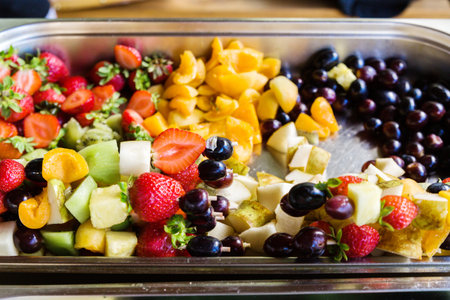 Fruit in a metal tray. Before serving, the fruit is strung on a skewer. Horizontal photoの写真素材