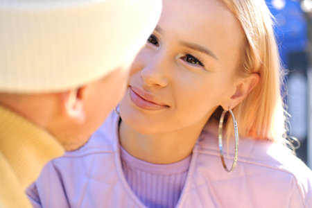The girl looks at the guy with loving eyes. Horizontal photoの写真素材