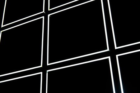 white led light strip on black wall form a square pattern. Horizontal photo