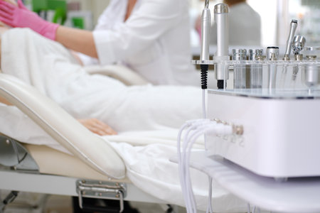 A serene treatment room in a cosmetic clinic with state-of-the-art skincare machinery, ready for patient proceduresの写真素材