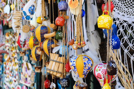 Colorful traditional Turkish crafts, including evil eye amulets and ceramic ornaments, displayed at a local artisan shop.の写真素材