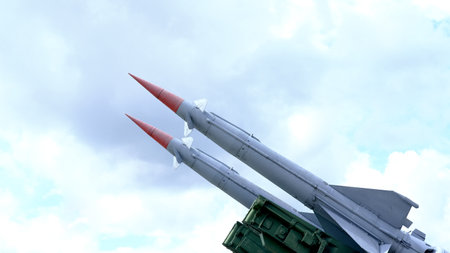 Two military missiles ready for launch, captured against a clear sky. The image highlights the precision and readiness of modern weaponry.の写真素材