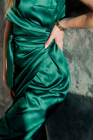 Elegant Emerald Green Satin Dress Detailの写真素材
