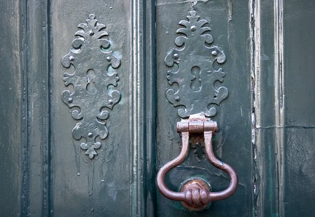 Knocker on an old door in the city of Lisbonの写真素材