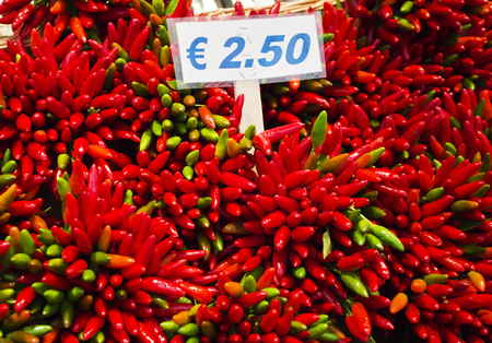 Red chillies on a market stall in Venice, Italyの写真素材