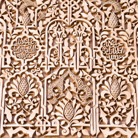 Detail of the decorative bas-relief on the walls of the north portico in the Court of the Myrtles, in The Alhambra, Granada, Spainの写真素材