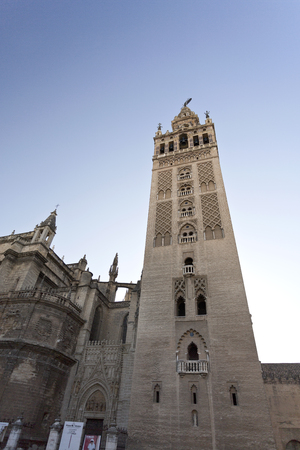 View of The Giralda, the bell tower of the Seville Cathedral in Seville, Spainの写真素材