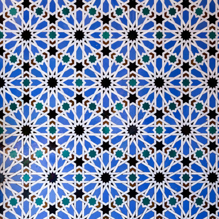 The classic geometric pattern of the Moorish tiles in the Alcazar of Seville, Spain