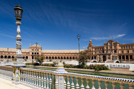 Detail of the ceramic tiled balustrade and lamp pole at the Plaza de Espana (Spain Square) in...