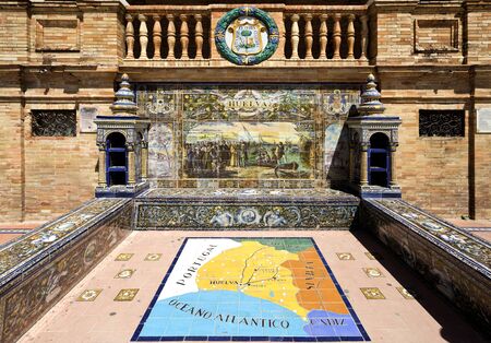 Detail of one of the many tiled Provincial Alcoves along the walls of the Plaza de Espana (Spain Square) in Seville, Spainの写真素材