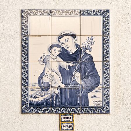 Tile panel with the image Saint Anthony, the patron saint of Lisbon, can be found on the streets of Lisbon, Portugalのeditorial素材