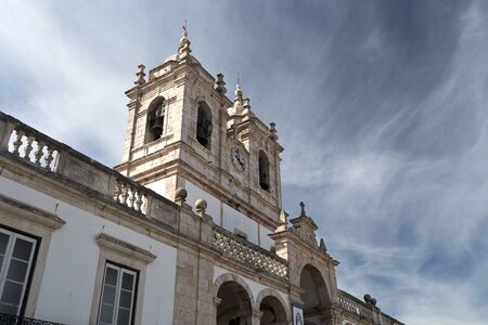 The imposing Church of Our Lady of Nazare (Igreja de Nossa Senhora da Nazare) located on the hilltop O Sitio overlooking Nazare, Portugalの写真素材