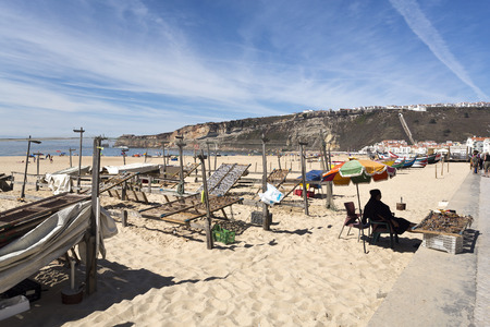 Drying and selling dried fish on the beach of Nazare, Portugalのeditorial素材