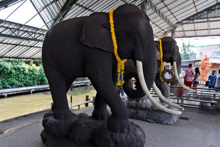 Ceramic statues of full size elephants on a river cruise terminal near the floating markets of Bangkok, Thailandのeditorial素材