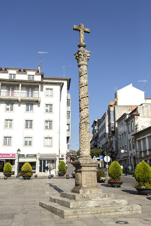 In the Cathedral Square is the nineteenth century calvary sculpture (cruceiro) on top of a Corinthian Solomonic column, in Braganca, Portugalのeditorial素材