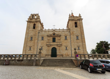 Catholic cathedral of mannerist style with an austere facade flanked by imposed bell towers on each side and surmounted by rail, in Miranda do Douro, Portugalのeditorial素材