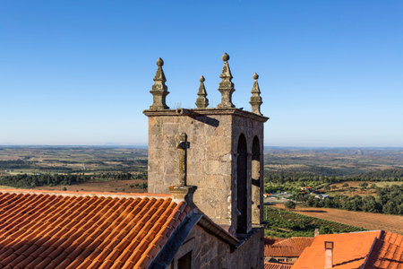 Romanesque bell tower of the Church of Our Lady of Rocamador, in the historic village of Castelo Rodrigo, Portugalの写真素材