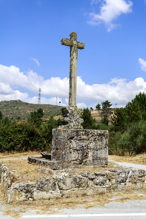 Detail of the stone Latin cross ornamented with vegetable decoration, at the northern end of the bridge of Lavandeira, near Celorico da Beira, Beira Alta, Portugalの写真素材