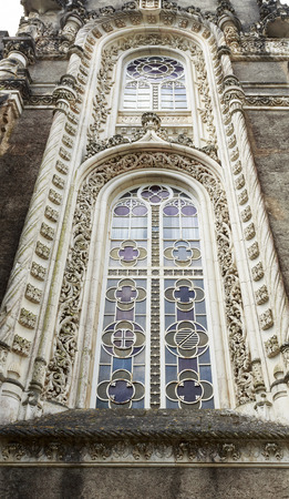 Window in the Neo-Manueline architectural style of the Palace Hotel of Bussaco, built in late 19th century, in Bussaco, Portugalのeditorial素材